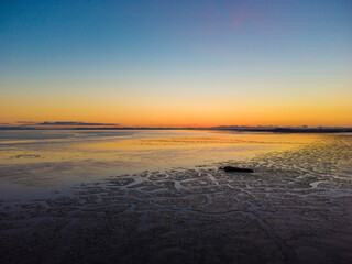 Laces of low tide at sunset