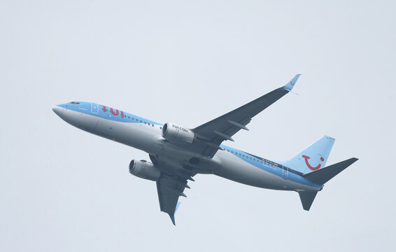 Dusseldorf, Germany - June 21, 2024: Boeing 737-8K5 operated by TUI fly (registration number: D-ATYL) in the sky over Dusseldorf city