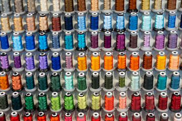 colorful sewing spools of thread for quilting