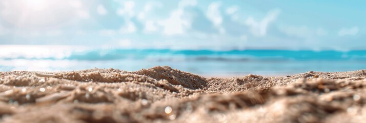 Close-up of Sandy Beach with Ocean Background