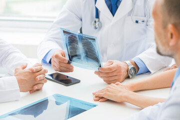 doctors examine x-rays