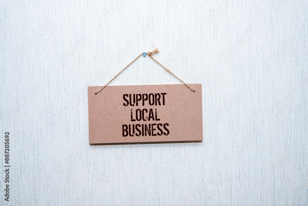 Poster Support local business text written on a notepad