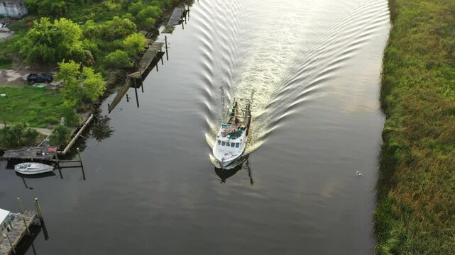 Aerial View Around Boat Sailing Down Scipio Creek in Apalachicola Florida