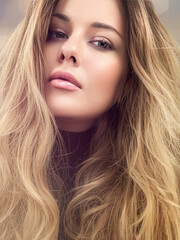 Naklejka premium Beautiful modern blonde woman with volume hairstyle, long luxurious hair and beauty makeup, glamorous look face portrait for luxury fashion and natural cosmetics idea