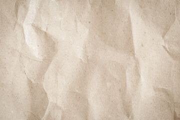 Naklejka premium Crumpled brown paper texture background for design with copy space for text or image.