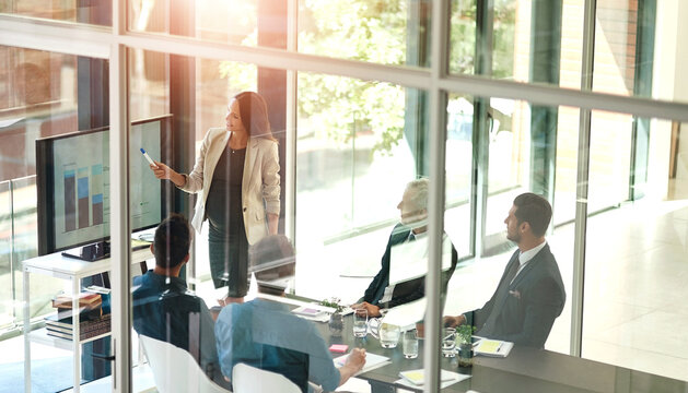 Business woman, presentation and conference room glass with collaboration and digital chart. Speaker, financial and accounting data with workshop and presenter in office with company stats review