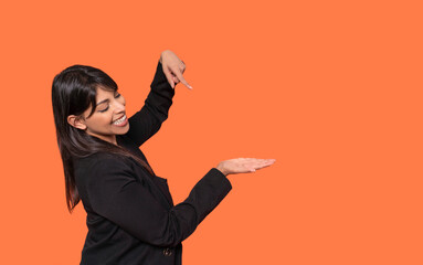 Woman in Black Blazer Gesturing With Open Palm and Finger Pointing