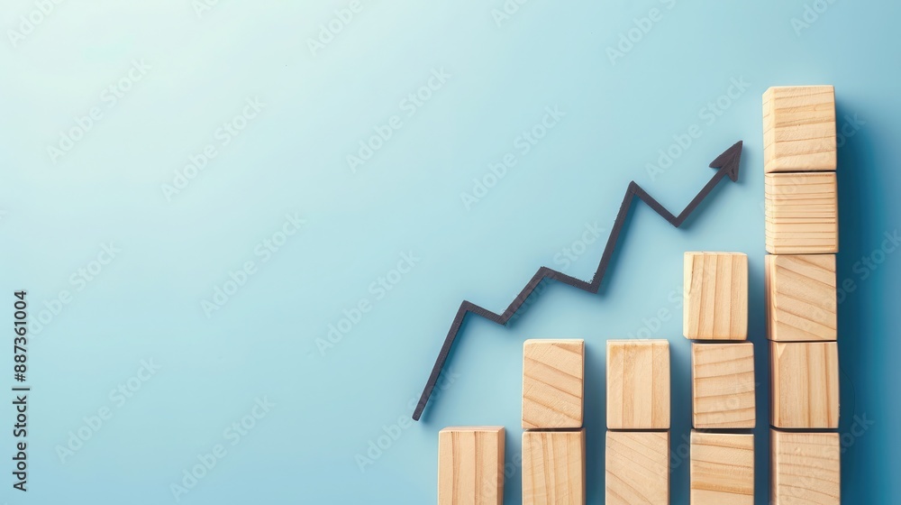 Poster blue background with wooden blocks displaying a growth graph and upward arrow, signifying business d