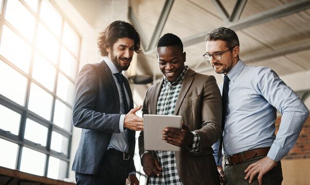 Business, men and real estate with clients on tablet at empty office for rental contract or lease agreement. People, diversity and happy or smile with partnership for property and building sale