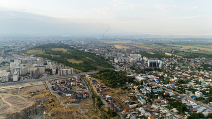 Aerial view of Bishkek cityscape with residential and industrial areas