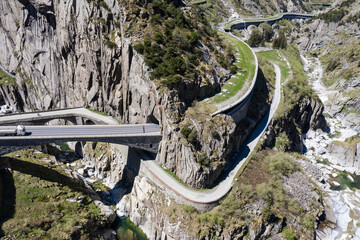Gotthard, Switzerland: Aerial drone view of the Gotthard pass mountain road and the devil's bridge near Andermatt in Canton Uri in Switzerland in the alps.