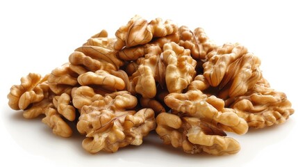 Close-up of walnuts scattered on a white surface.