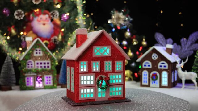 Against the background of Christmas trees with blinking garlands of an Advent wreath and houses with a typewriter, an orange house rotates