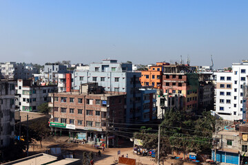 Fototapeta premium Colorful Urban Residential Area with People Engaged in Daily Activities and Construction Work under Clear Blue Sky