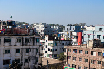 Colorful Urban Residential Area with People Engaged in Daily Activities and Construction Work under Clear Blue Sky