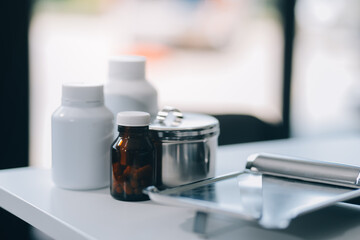 Health care billing statement with stethoscope, bottle of medicine for doctor's work in medical center stone background.