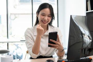 Young woman celebrate successful stock trading