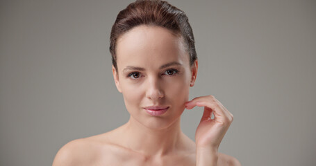 Beauty, health, cosmetics, anti-aging therapy and skin care concept - young beautiful brunette...