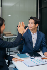 Happy smiling Lawyer feel happy work complete Teamwork success, success after discussing a contract agreement done.