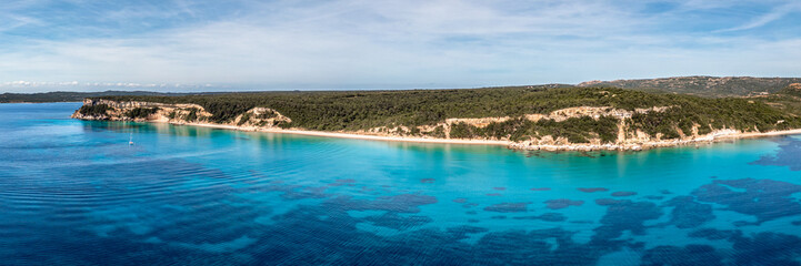 Panoramic aerial view of the Plage de Vo'lpe and the translucent turquoise Mediterranean sea on the south east coast of the island of Corsica