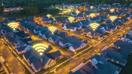 Homes with Wi-Fi connectivity symbols animated at night. Modern American residential area. Digital...