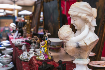 Figurine bust of a young woman with child on flea market Arezzo Italy