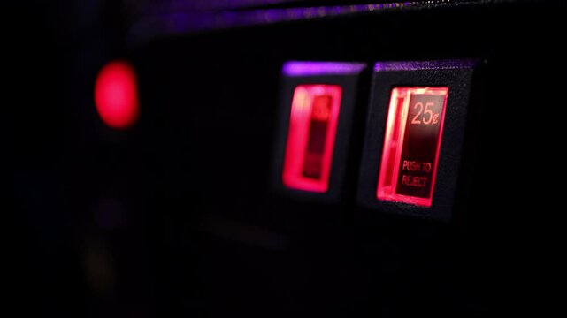 Coin door of pinball machine focused on quarter slot 4k