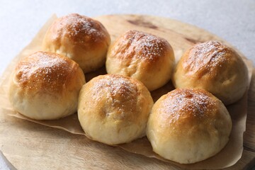 Delicious dough balls on grey table, closeup