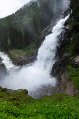 Naklejka premium Majestic Krimml Waterfall in Austria's Summer Splendor