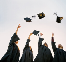 Students, smile and throw graduation cap on campus with celebration and success. People, college...