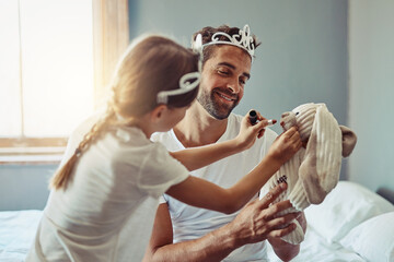 Playing, tiara and dad with kid with makeup for bonding, happy relationship and parenting in bedroom. Family, home and father with girl with toys for princess costume, pretend and games on weekend © NonVig/peopleimages.com