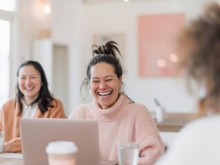 Fototapeta premium Joyful Multiracial Coworkers Creating and Sharing a Meme in a Bright Modern Office