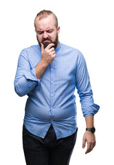 Young caucasian hipster man over isolated background with hand on chin thinking about question, pensive expression. Smiling with thoughtful face. Doubt concept.