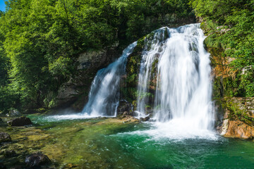 Fototapeta premium Majestic Virje Waterfall: Pristine Natural Gem in Slovenia's Wilderness