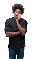 Afro american man over isolated background thinking looking tired and bored with depression problems with crossed arms.