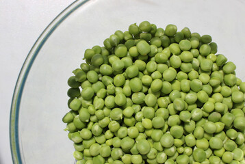 Transparent Bowl With Green Peas Preparing To Cooking Isolated On White 
