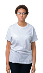 Beautiful young african american woman wearing glasses over isolated background Relaxed with serious expression on face. Simple and natural looking at the camera.