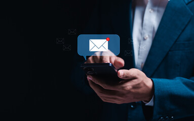 Email concept, business e-mail communication and digital marketing. Businessman using smartphone...