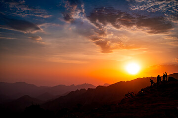 Silhouette people on mountain against sky during sunset from As Safa, Taif, Saudi Arabia