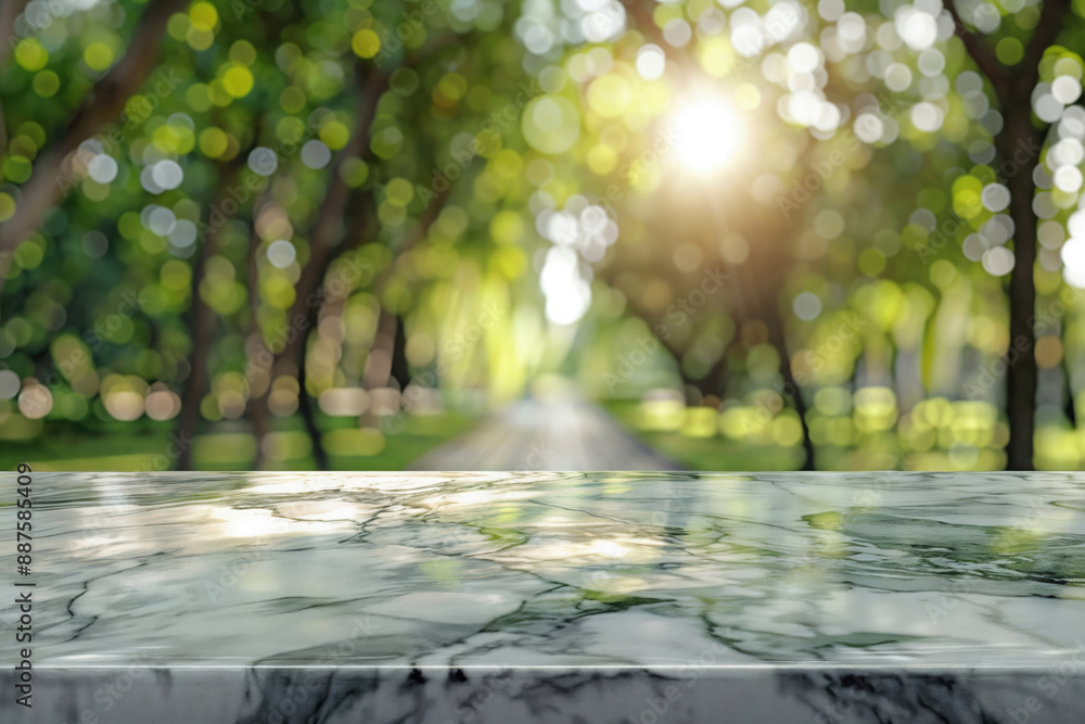 Poster empty marble table top shining with sunlight in blurred park background, for product display and mon