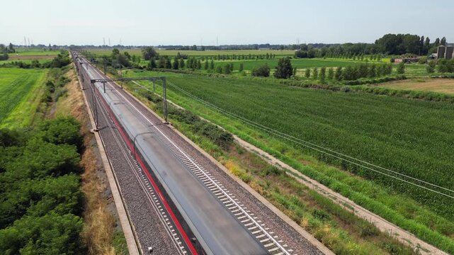 Europe, Italy , Milan - Frecciarossa Hight speed 300km h train raylway from Milano  to Rome view from the drone - the faster way to travel in Italy for tourist and passengers - tourist destination 