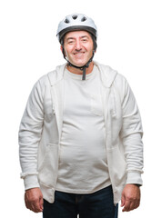 Handsome senior cyclist man wearing bike helmet over isolated background with a happy face standing and smiling with a confident smile showing teeth
