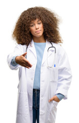 African american doctor woman, medical professional working holds hands welcoming in handshake pose, expressing trust and success concept, greeting