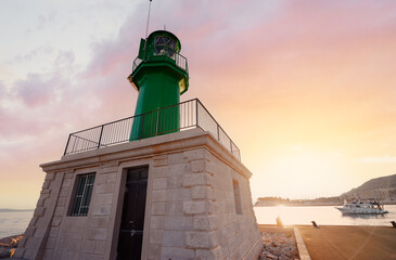 Green lighthouse on the shore in Split, Croatia.