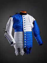 Historical fashion. Medieval knight cloth. Padded jacket gambeson.