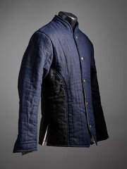 Historical fashion. Medieval knight cloth. Padded jacket gambeson.