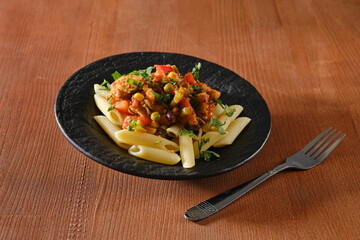 Beef slices fried with vegetables and spicy sauce with pasta