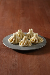 Georgian boiled dumplings - khinkali stuffed with lamb or beef minced meat