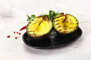 Sliced fresh avocado on the grill