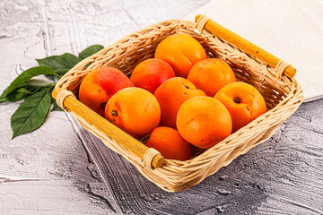 Raw ripe sweet apricots heap